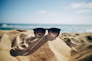 Airbnb vs. Vrbo: sunglasses on the beach