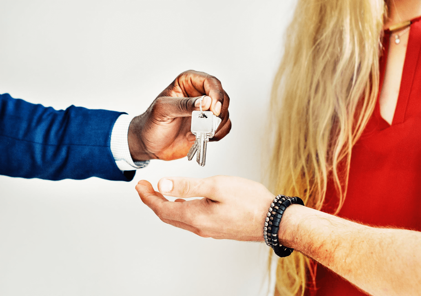 Person handing keys to someone