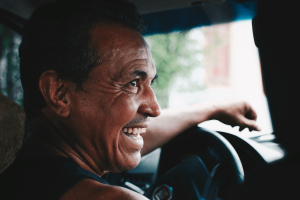 What is UberX: Smiling man drives a car