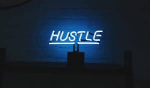 Ways to make extra money: Hustle neon sign