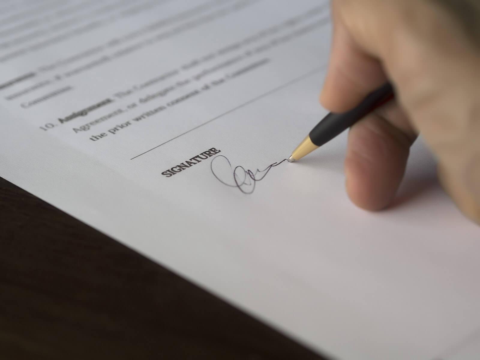 Non-compete agreement: A hand signs a contract