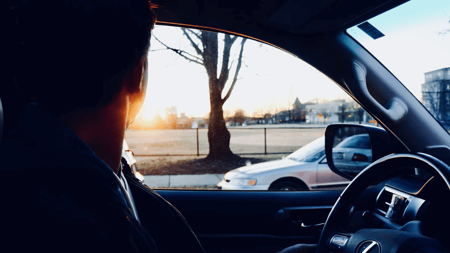 Drive for Lyft: A driver looks out his window at a park