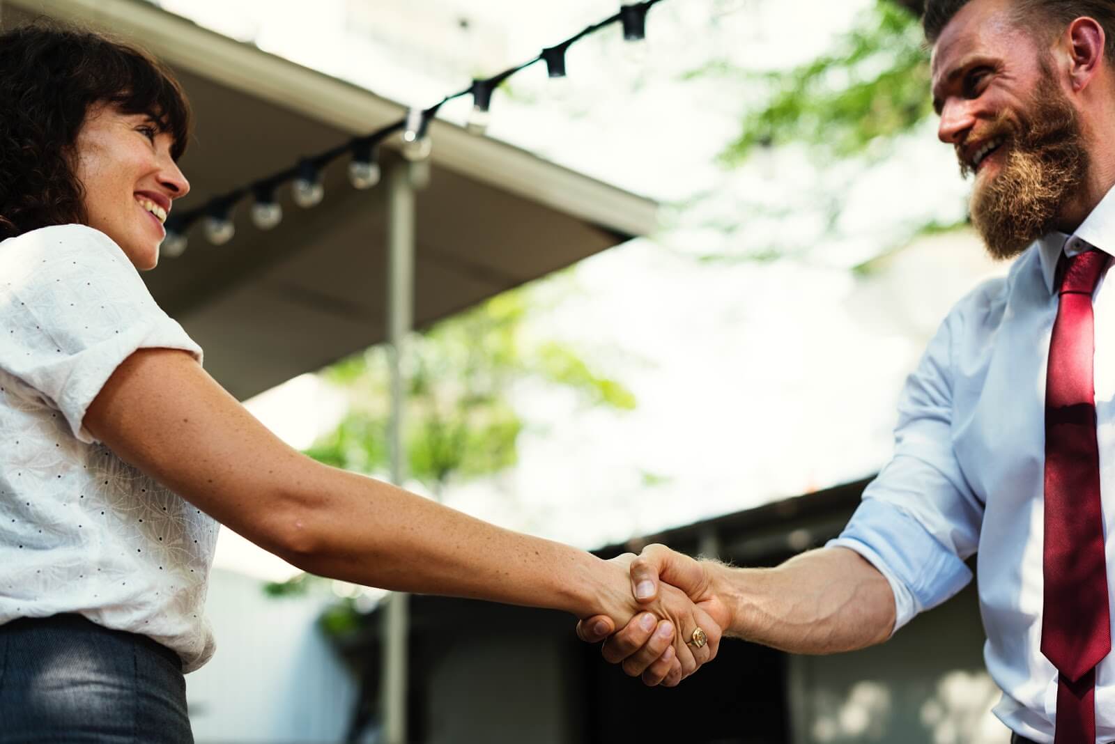 How to become a professional organizer: Two professionals shake hands