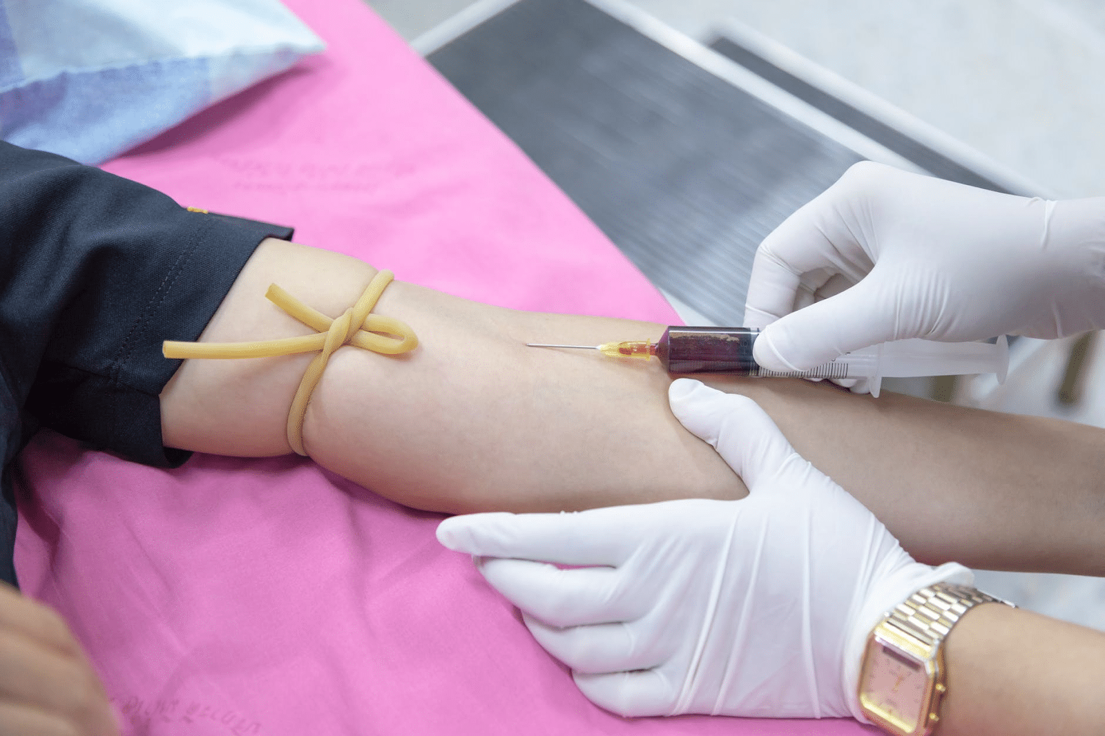 Selling plasma: A nurse draws blood for a physical exam