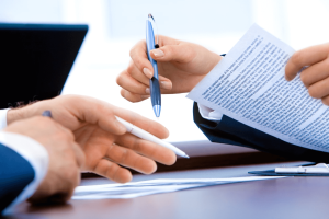 Executive summary example: Two people review business papers