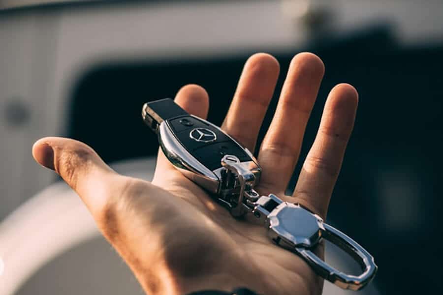 Close-up of man's hand holding car keys