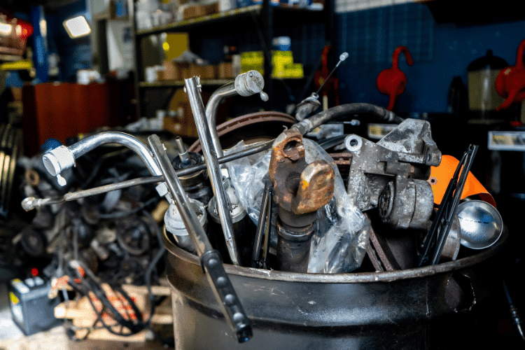 Scrap metal for junk removal in a mechanic automobile repair shop