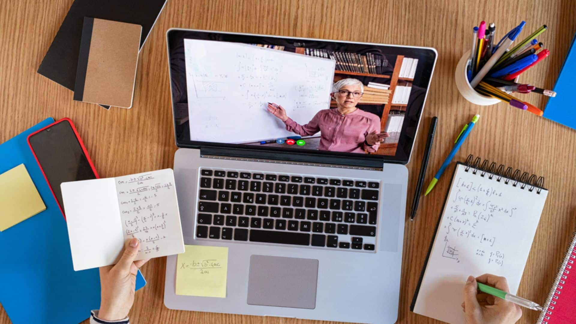 image showing a teacher on the screen of a laptop - virtually teaching students - best side hustles for teachers header
