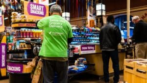 image showing a man wearing an instacart shirt - header graphic for jobs like instacart post on gigworker.com