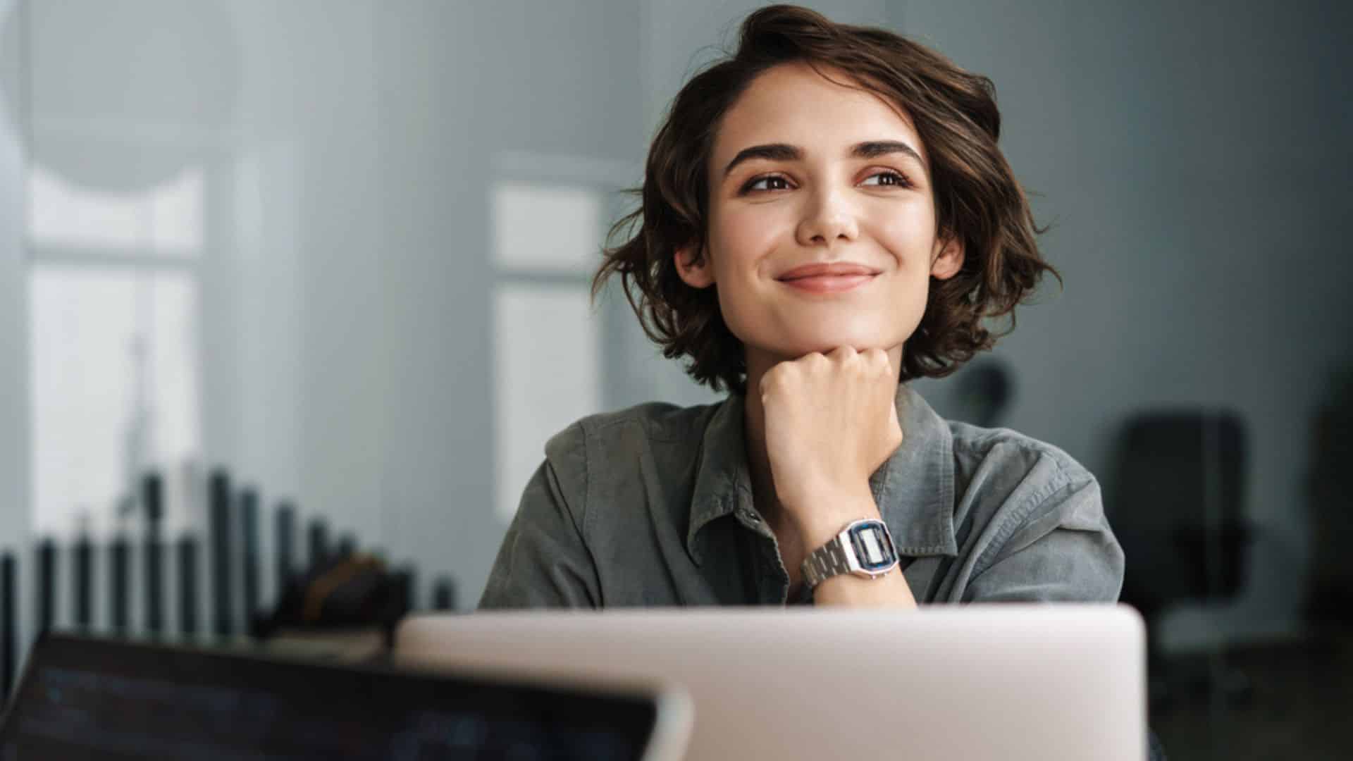 image showing a woman happy at work - to illustrate low-stress jobs